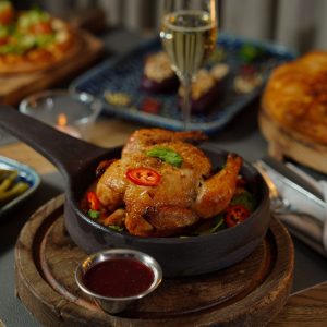 Roast chicken served in a cast-iron pan